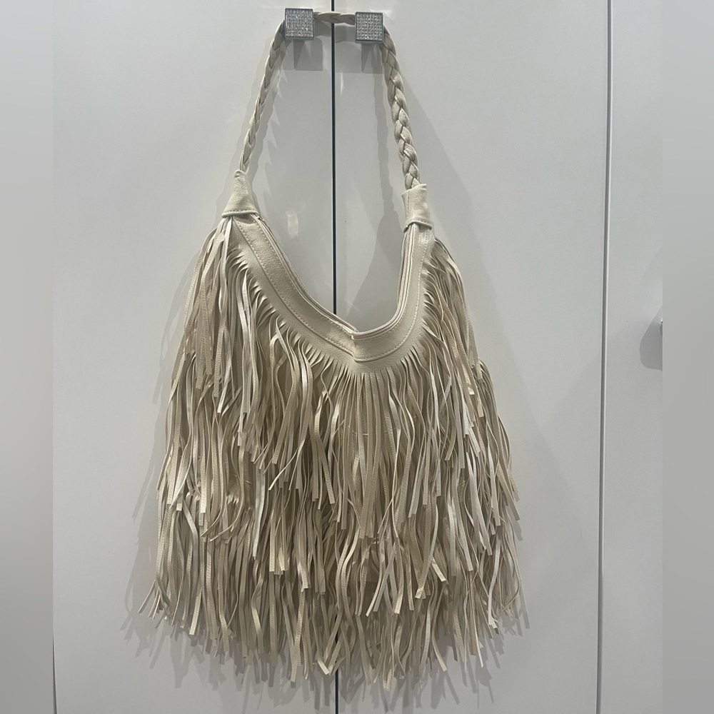 New cream fringe purse. Never used super cute